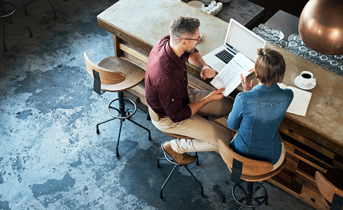 Business Owners reviewing paperwork at a table