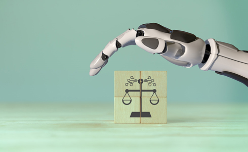 a robotic arm over an image of the scales of justice