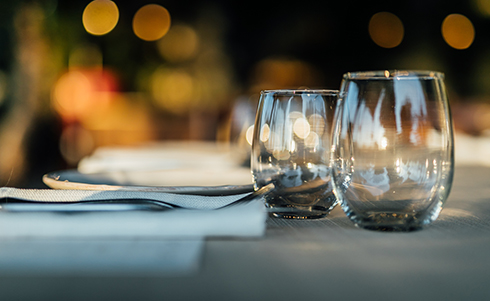 Images of two empty drink glasses at a restaurant