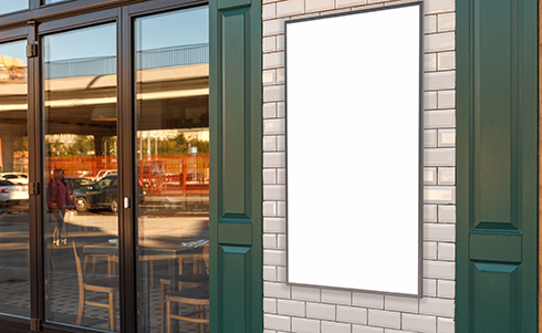A blank sign outside of a cafe