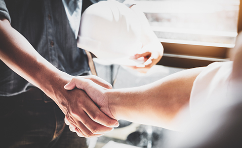 Contractors shaking hands