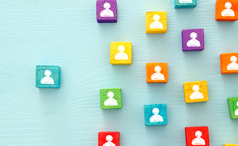 Multicolored blocks with shapes of people representing staffing