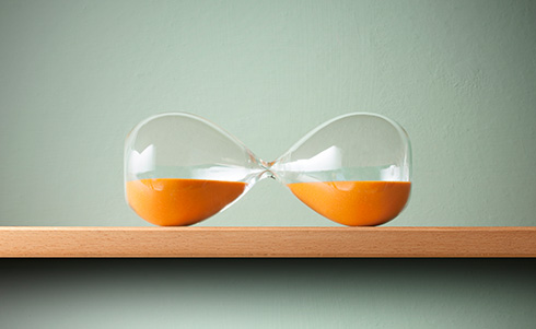An hour glass flipped on its side